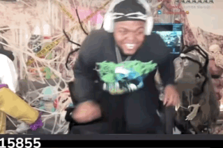 Man in Headphones Dancing in Front of Screen With Number 15855