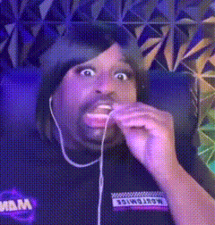 Man in Headphones Eating Cookie Making Funny Face