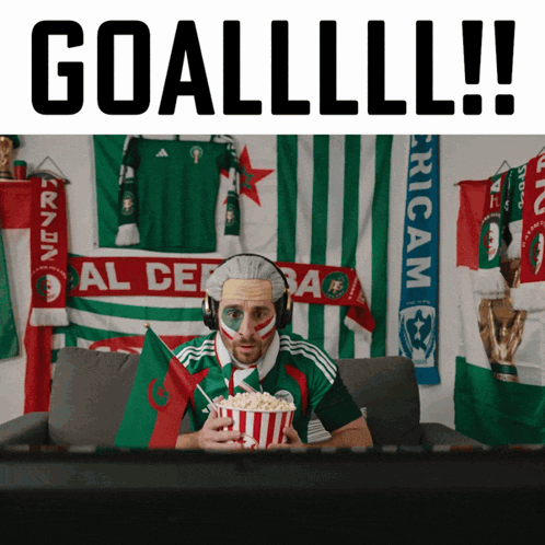 Man In Headphones Holding Popcorn Watching Soccer Goallll GIF