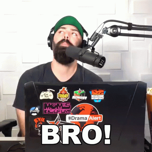 Man in Headphones in Front of Microphone and Laptop Says Bro
