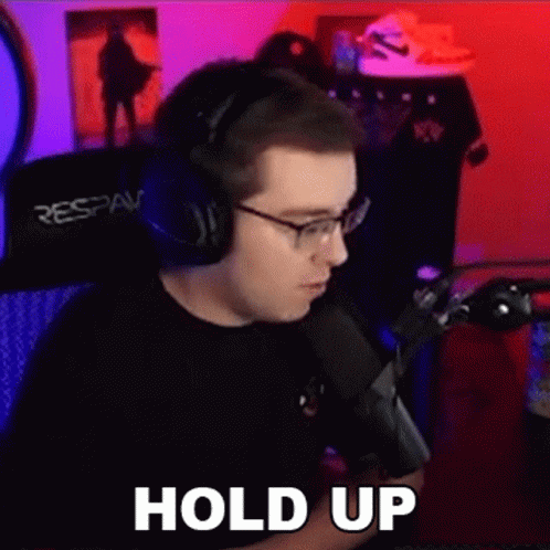 Man in Headphones Making Funny Face at Mic