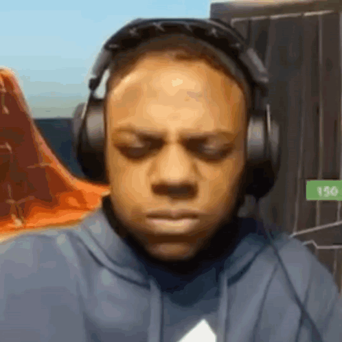 Man in Headphones Making Funny Face Playing Video Game