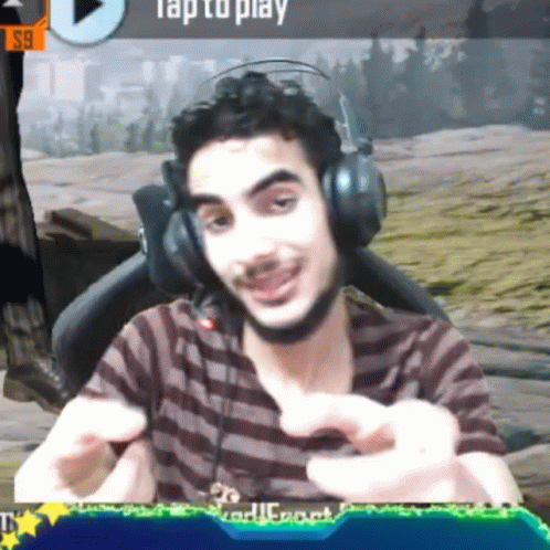 Man in Headphones Playing Video Game