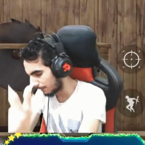 Man in Headphones Sitting in Chair