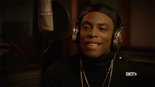 Man In Headphones Smiling At Microphone With BET Logo GIF