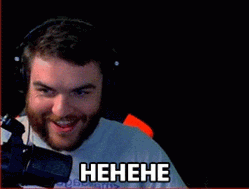 Man in Headphones Smiling at Screen Saying Players Matty Thicc Techni