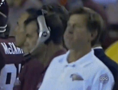 Man in Headphones Watching Football Player McCann