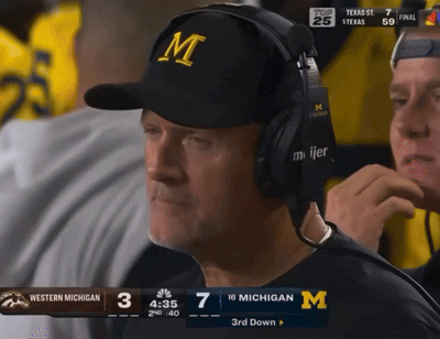 Man in Headphones Watching Western Michigan vs Texas Football