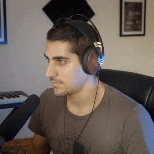 Man in Headphones Wearing Eclectic T-Shirt