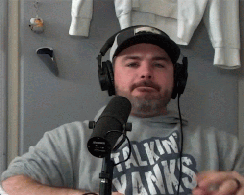 Man in Headphones Wearing Talkin Vanx Shirt