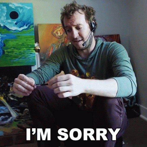 Man in Headset Saying I'm Sorry Holding Pen