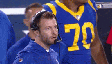 Man in Headset With Number 70 on Shirt