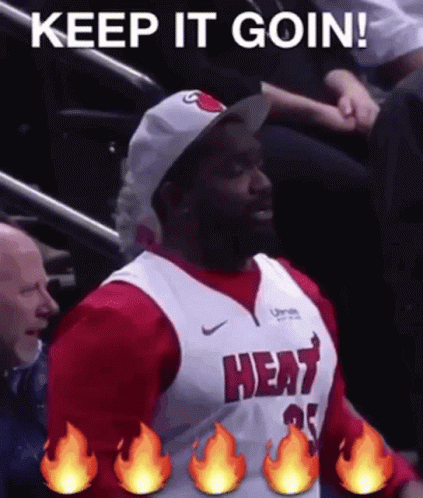 Man in Heat Jersey Sitting in Stadium