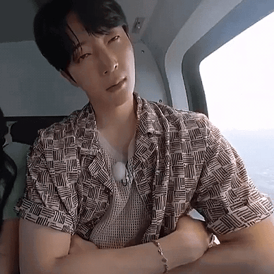Man In Helicopter Arms Crossed Looking At Camera GIF