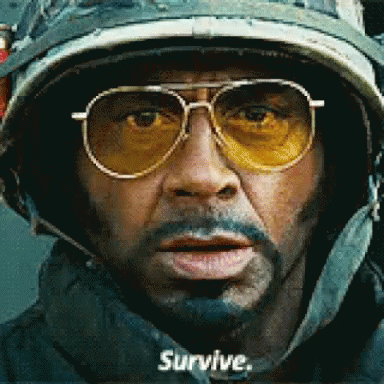 Man In Helmet And Sunglasses Says Survive GIF