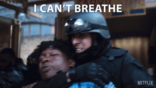 Man in Helmet Holding Another Man Breathe