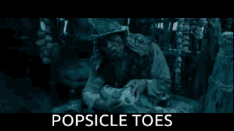 Man in Helmet Holding Child Popsicle Toes