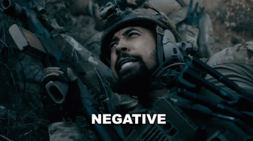 Man In Helmet Holding Gun Saying Negative GIF