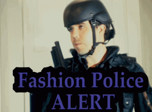 Man in Helmet Holding Gun With Fashion Police Alert