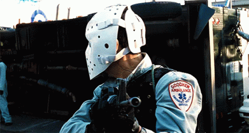 Man in Helmet Holding Gun