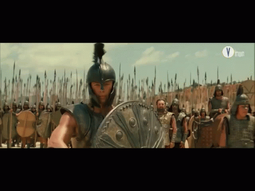 Man In Helmet Holding Shield Before Soldiers Letter V GIF