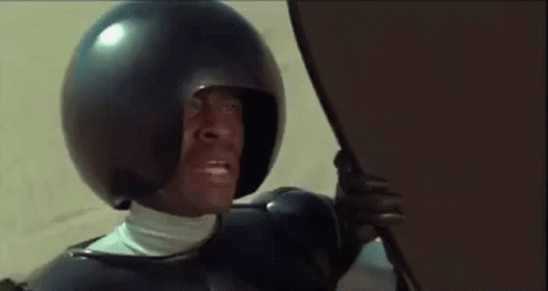 Man In Helmet Holding Shield GIF