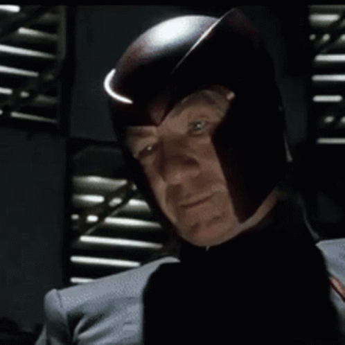 Man In Helmet Looking At Camera GIF