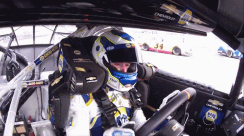 Man in Helmet Sitting in Race Car 34