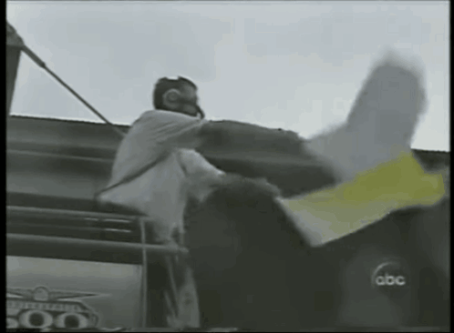 Man In Helmet Standing On ABC Plane GIF