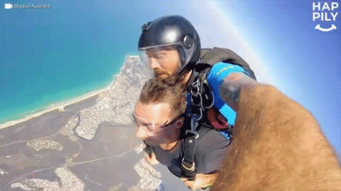 Man in Helmet Taking Mid-Air Selfie Hap Pily