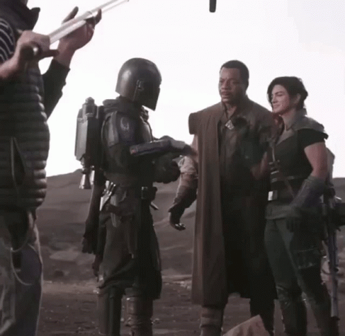 Man in Helmet Talking to Woman in Black