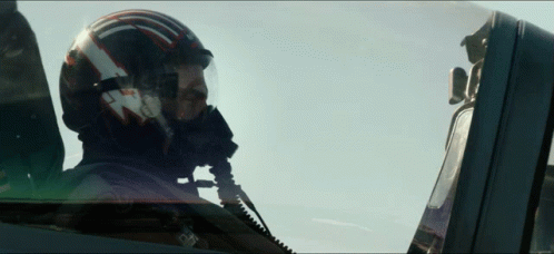 Man in Helmet with T in Cockpit