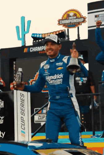 Man in Hendrick's Car Holding Bell