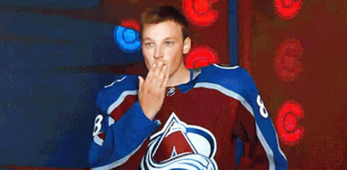 Man in Hockey Jersey Blowing Kiss