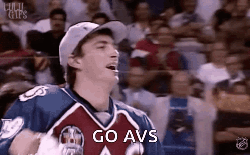 Man in Hockey Jersey Shouting Go Avs