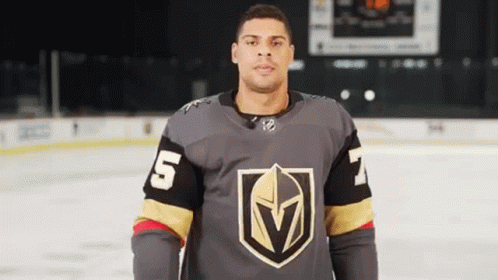 Man in Hockey Jersey Standing on Rink