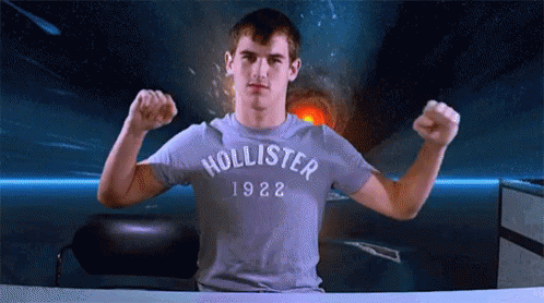 Man In Hollister 1922 T-Shirt Flexing Muscles GIF