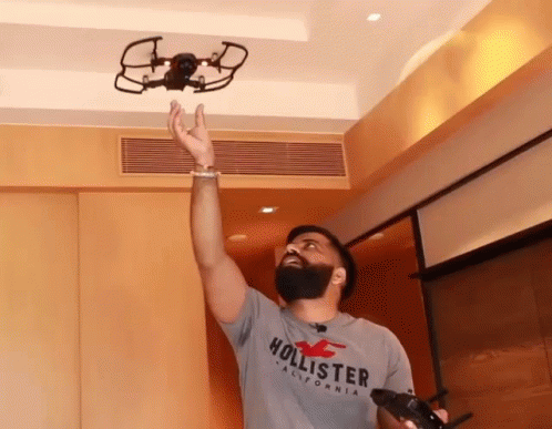 Man In Hollister Shirt Throws Drone GIF