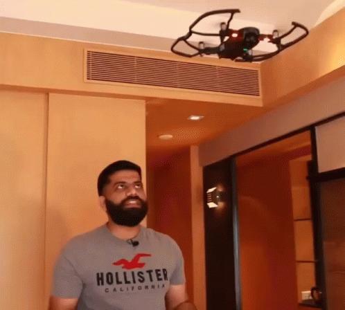 Man In Hollister T-Shirt In Front Of Drone GIF