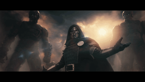 Man In Hooded Cloak Before Giant Men GIF