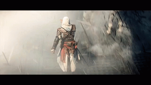 Man in Hooded Cloak Walking in Fog