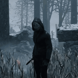Man in Hooded Jacket Holding Knife in Forest