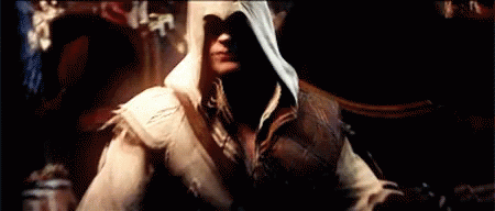 Man in Hooded Jacket in Dark Room