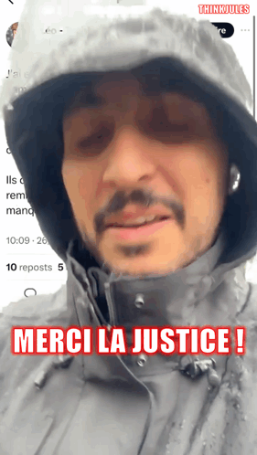 Man in Hooded Jacket Merci La Justice