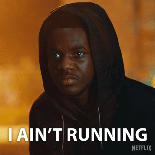 Man in Hooded Jacket Says I Ain't Running