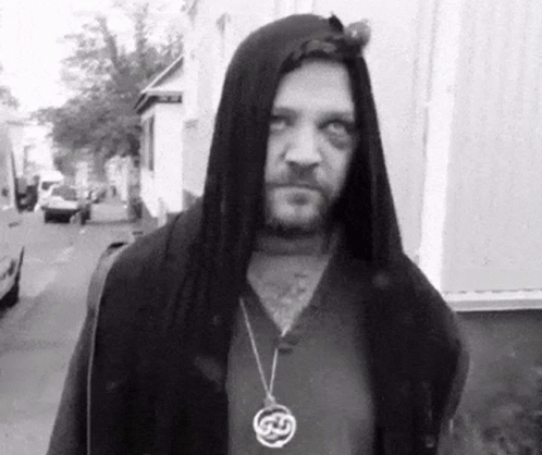 Man in Hooded Jacket with Celtic Necklace