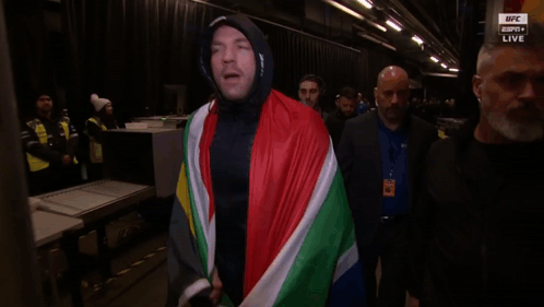 Man In Hooded Jacket With Flag GIF