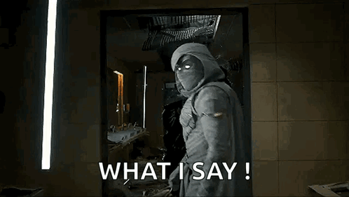 Man in Hooded Jacket With Glowing Eyes Saying What I Say!