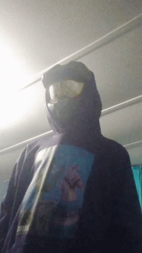 Man in Hooded Sweatshirt With Man Picture