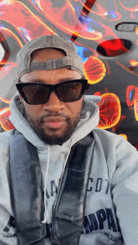 Man in Hoodie and Sunglasses